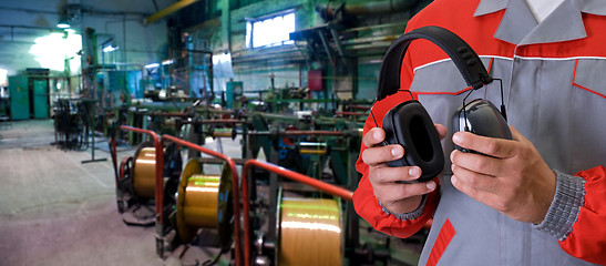 Image showing Worker with protective headphone