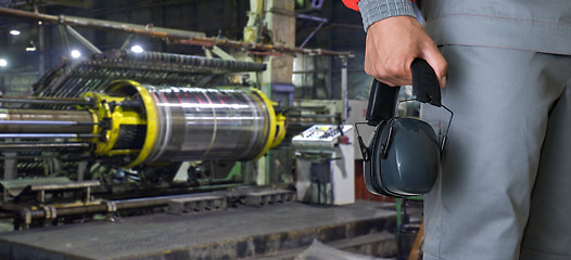 Image showing Worker with protective headphone