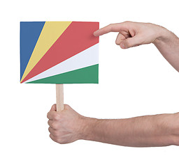 Image showing Hand holding small card - Flag of Seychelles