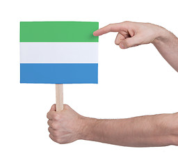 Image showing Hand holding small card - Flag of Sierra Leone