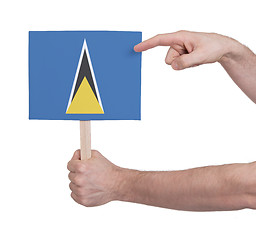 Image showing Hand holding small card - Flag of Saint Lucia