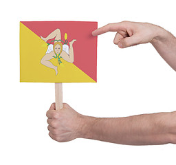 Image showing Hand holding small card - Flag of Sicily