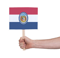 Image showing Hand holding small card - Flag of Missouri