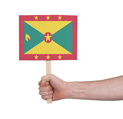 Image showing Hand holding small card - Flag of Grenada