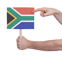 Image showing Hand holding small card - Flag of South Africa