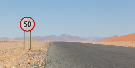 Image showing Speed limit sign at a desert road in Namibia