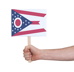 Image showing Hand holding small card - Flag of Ohio