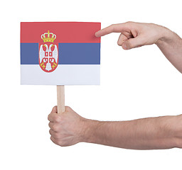 Image showing Hand holding small card - Flag of Serbia