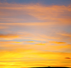 Image showing sunrise in the colored sky white soft clouds and abstract backgr