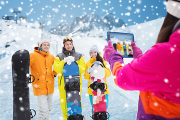 Image showing happy friends with snowboards and tablet pc