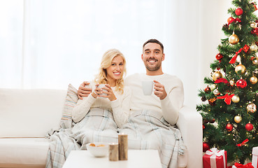 Image showing happy couple at home with christmas tree