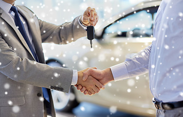 Image showing close up of handshake in auto show or salon