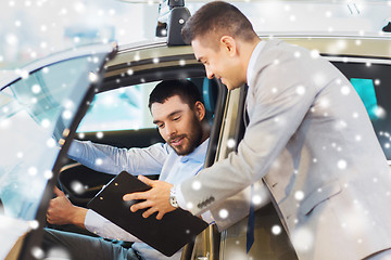 Image showing happy man with car dealer in auto show or salon