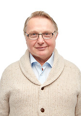 Image showing smiling senior man in cardigan