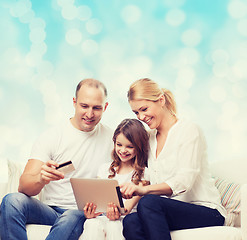 Image showing happy family with tablet pc and credit card