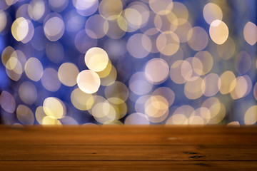 Image showing empty wooden table with christmas golden lights