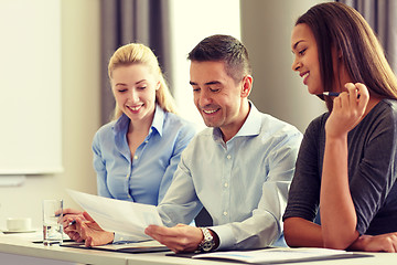 Image showing business people with papers meeting in office