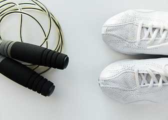 Image showing close up of sneakers and skipping rope