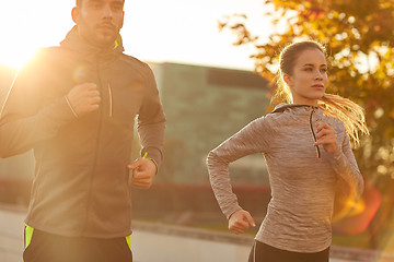 Image showing couple running outdoors