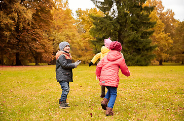 Image showing group of happy little kids having fun outdoors