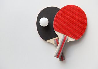 Image showing close up of table tennis rackets with ball