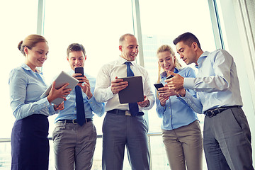 Image showing business people with tablet pc and smartphones