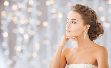 Image showing beautiful woman wearing shiny diamond earrings