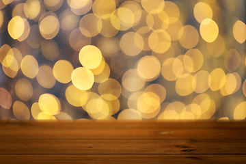 Image showing empty wooden table with christmas golden lights