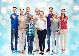 Image showing group of smiling people pointing finger on you