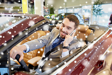 Image showing man calling on smartphone at show or car salon