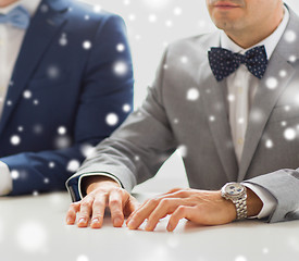 Image showing close up of happy male gay couple hands on wedding