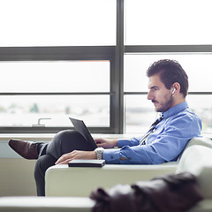 Image showing Businessman in office working on laptop computer.