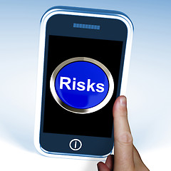 Image showing Risks On Phone Shows Investment Risks And Economy Crisis