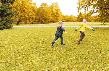 Image showing group of happy little kids running outdoors