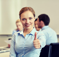 Image showing group of smiling businesspeople meeting in office