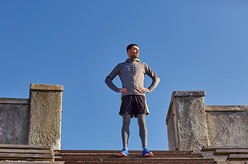 Image showing happy man on stadium stair