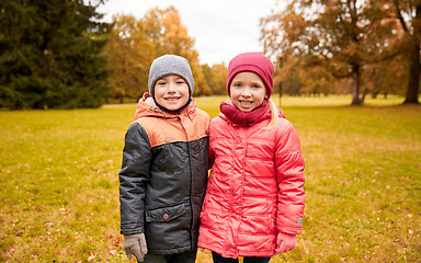Image showing happy little girl and boy in autumn park