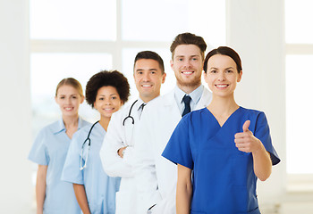 Image showing happy doctors showing thumbs up at hospital