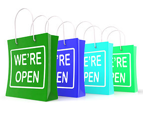 Image showing We\'re Open Shopping Bags Shows New Store Launch