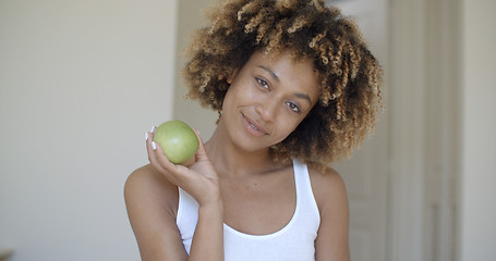 Image showing Young Woman With Green Apple In Hands