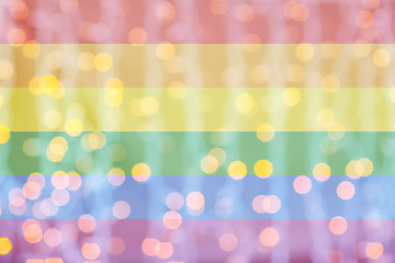 Image showing blurred golden lights over rainbow flag background