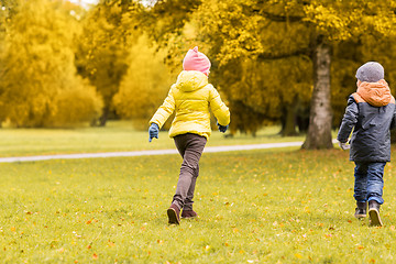 Image showing group of happy little kids running outdoors