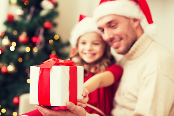 Image showing close up of father and daughter with gift box