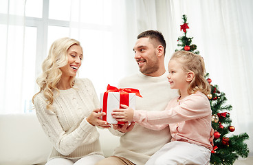 Image showing happy family at home with christmas gift box