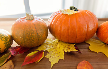 Image showing close up of pumpkins on wooden table at home