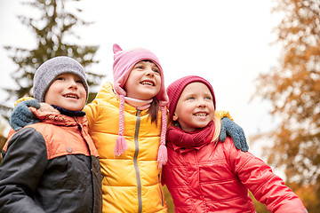 Image showing group of happy children hugging in autumn park