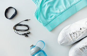 Image showing sportswear, bracelet, earphones and bottle set