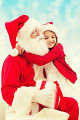 Image showing smiling little girl with santa claus