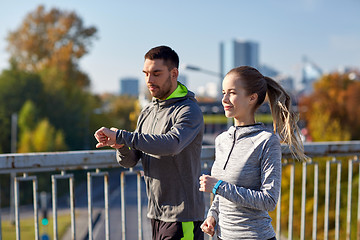 Image showing couple running over city highway bridge