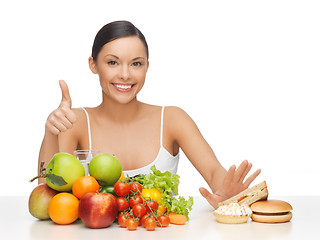 Image showing woman with fruits showing thumbs up